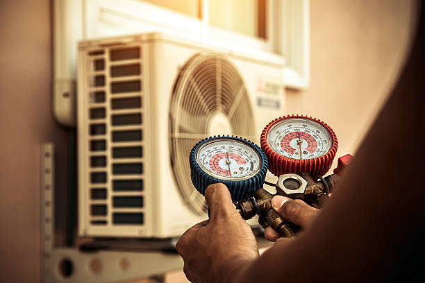 Professional Air Conditioning Service technician working in East Taunton, MA